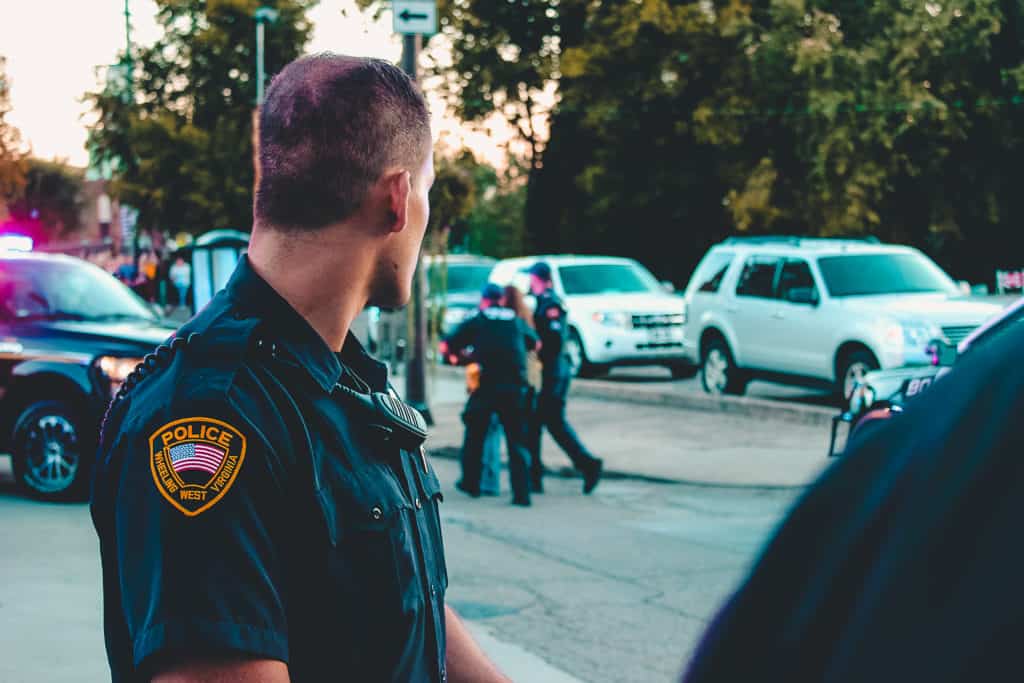 man wearing black officer uniform 1464230